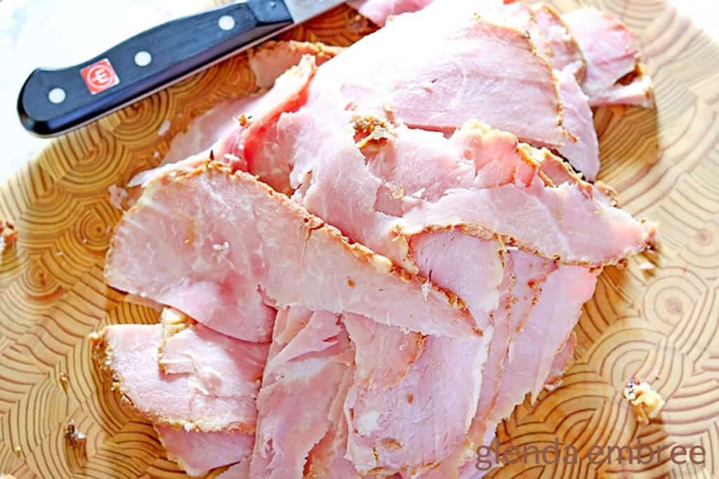 ham sliced on a wooden cutting board