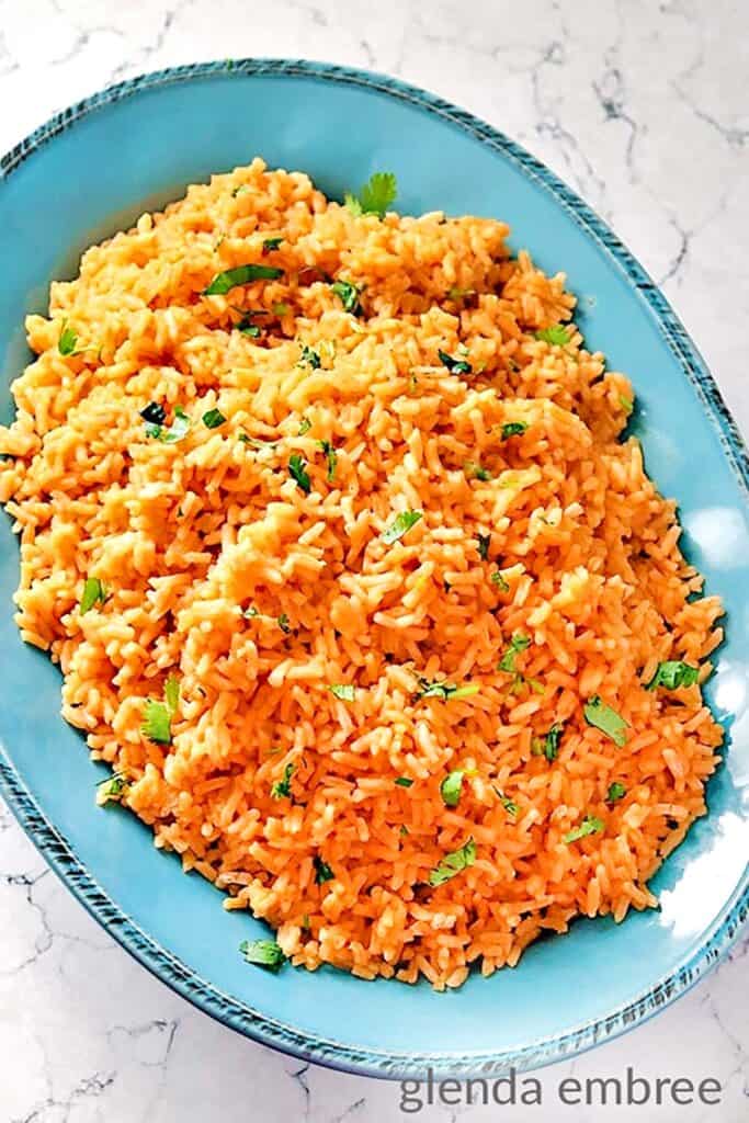 Easy 10-minute Mexican Rice served in a blue stoneware bowl.