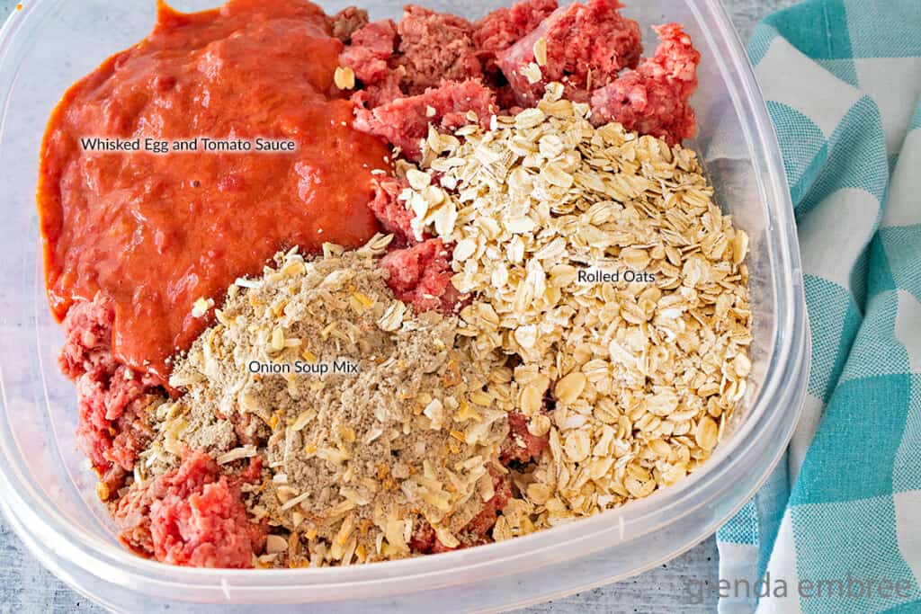 meatloaf ingredients labeled - rolled oats, onion soup mix, tomato sauce whisked with eggs