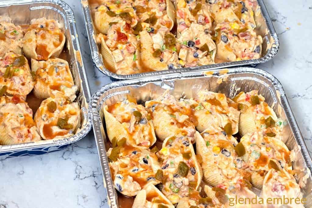 Mexican Chicken Stuffed Shells with filling and ready for cheese.