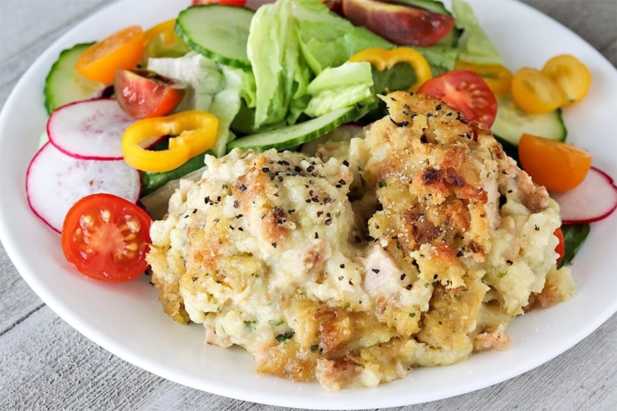 Thanksgiving Casserole on a white plate with House Salad.