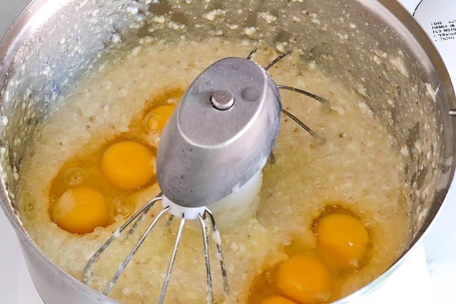 adding eggs to bowl