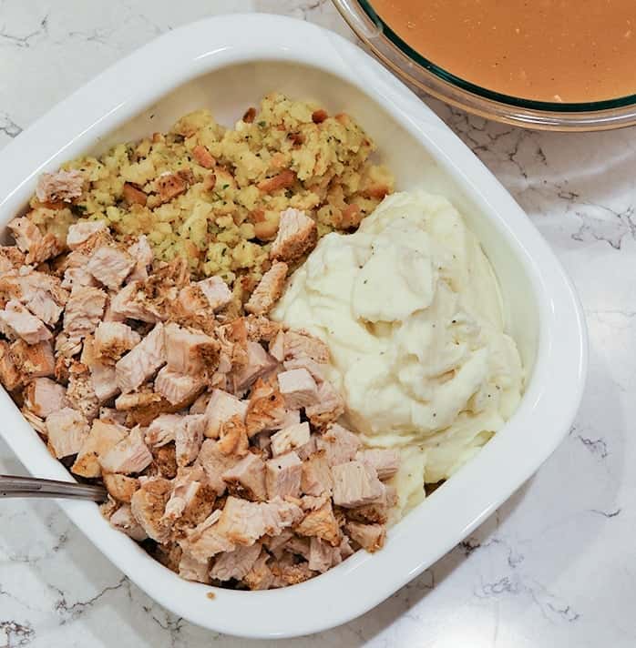 Ingredients for Thanksgiving Casserole prepped and in casserole dish