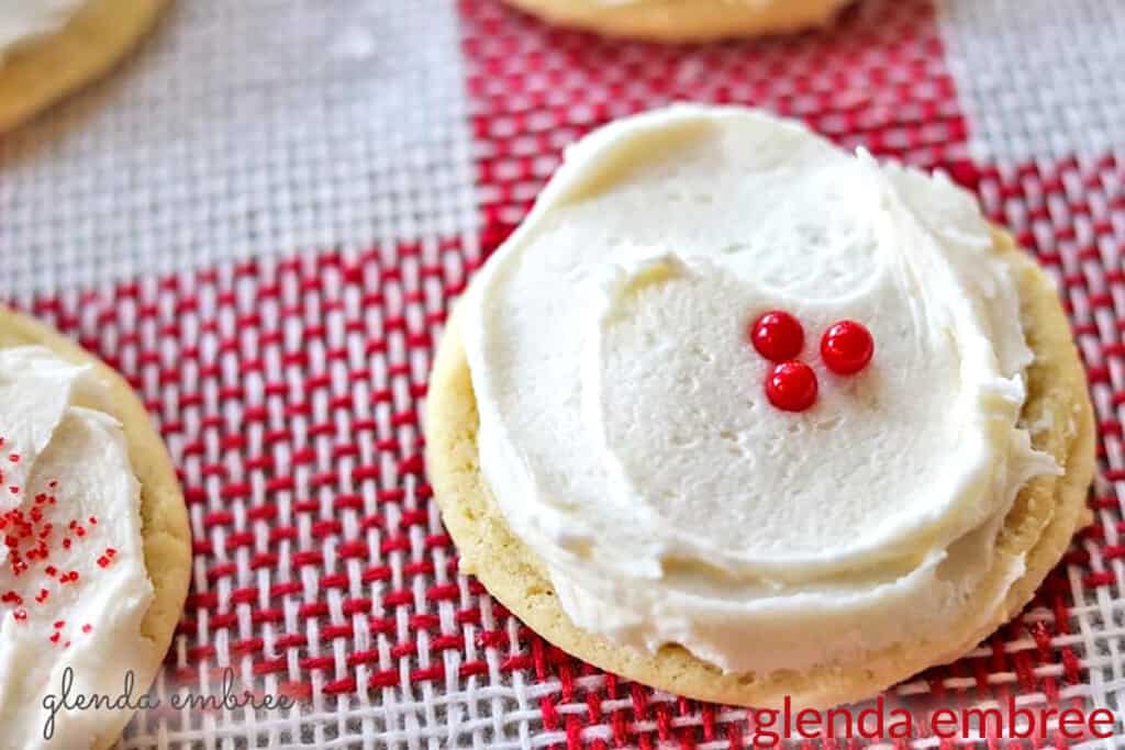 decorated sugar cookies on Red and white checked burlap