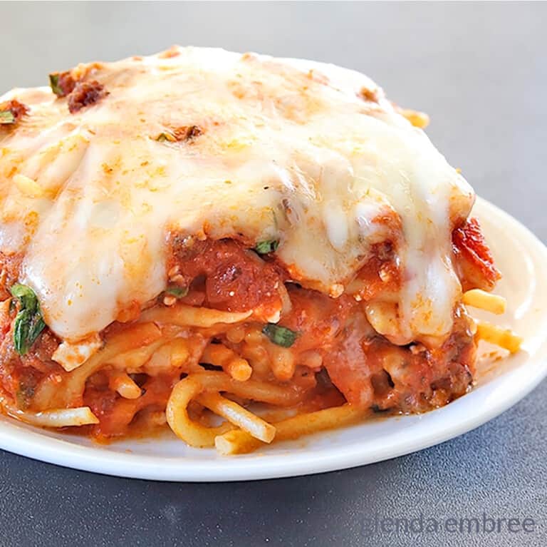 baked spaghetti on a white plate