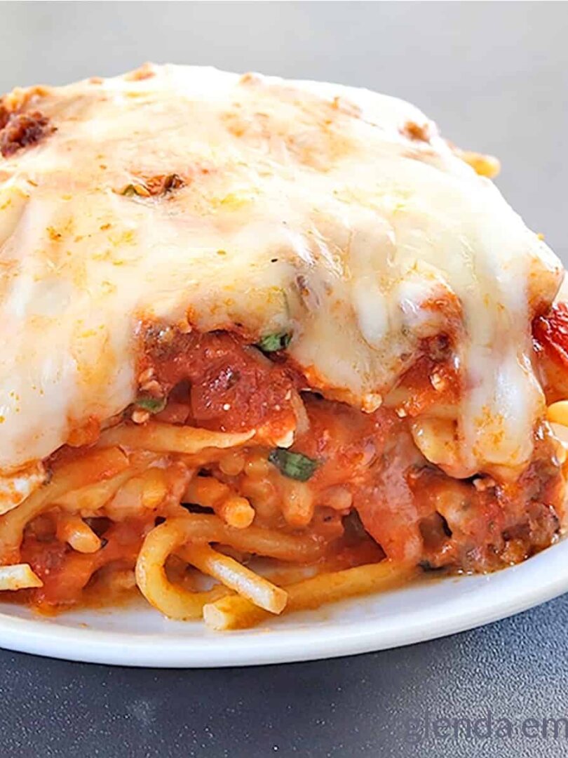baked spaghetti on a white plate