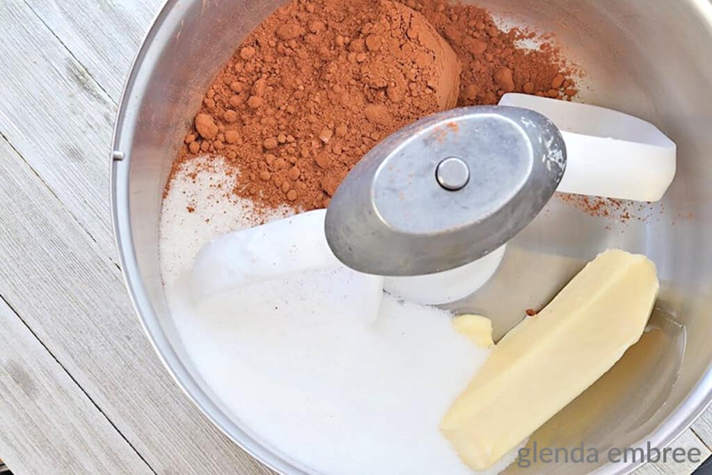 butter, sugar, vanilla and cocoa powder in a stand mixer bowl