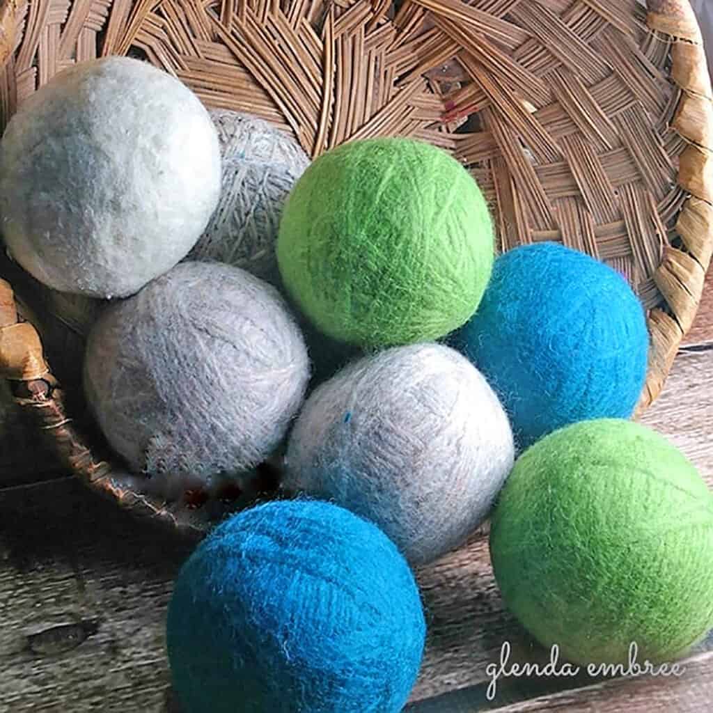 Homemade Wool Dryer Balls Spilling Out of a Wicker Basket