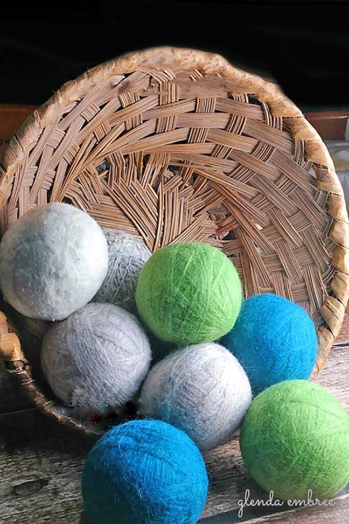 Homemade Dryer Balls in a wicker basket.