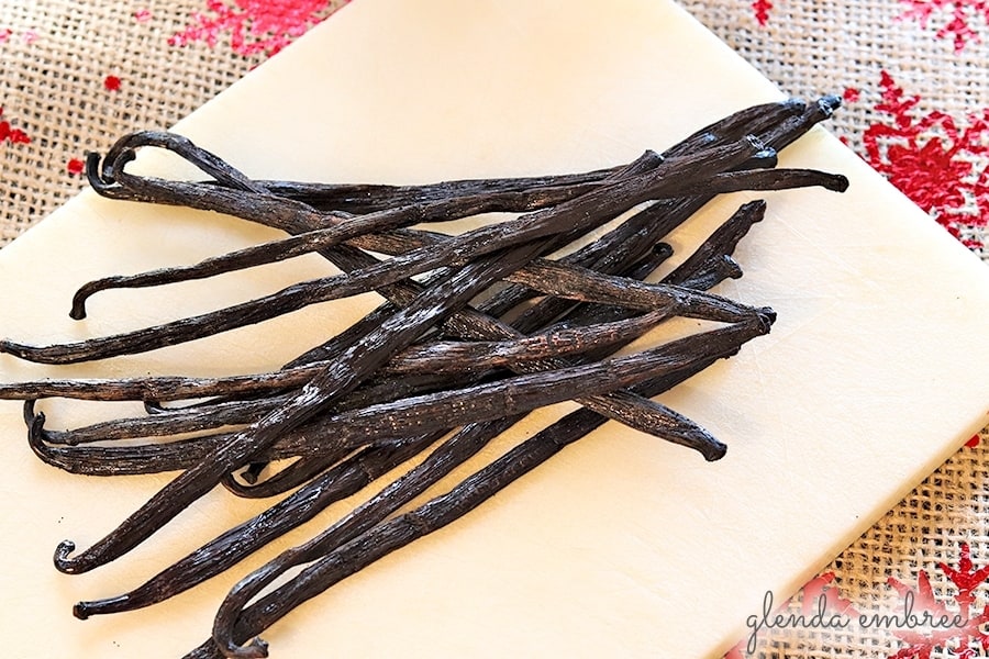 vanilla beans on a white cutting board