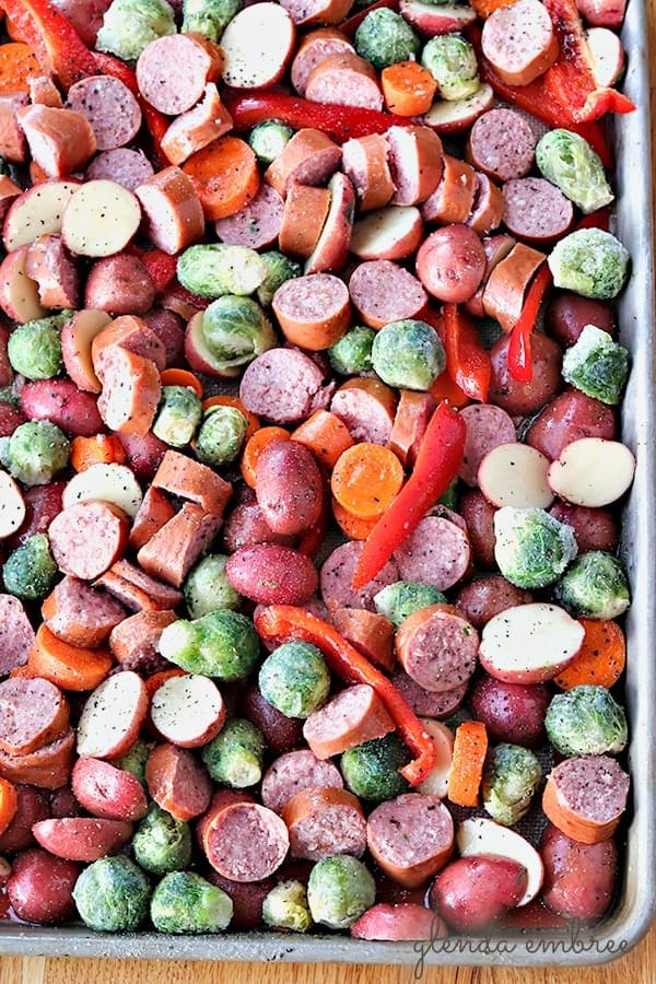sheet pan sausage and roasted veggies prepped for the oven