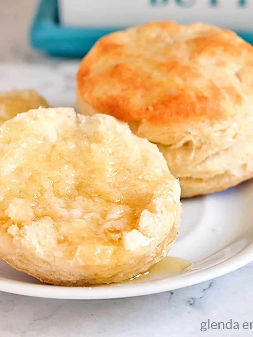Biscuits on a plate with butter and honey - bread recipes.
