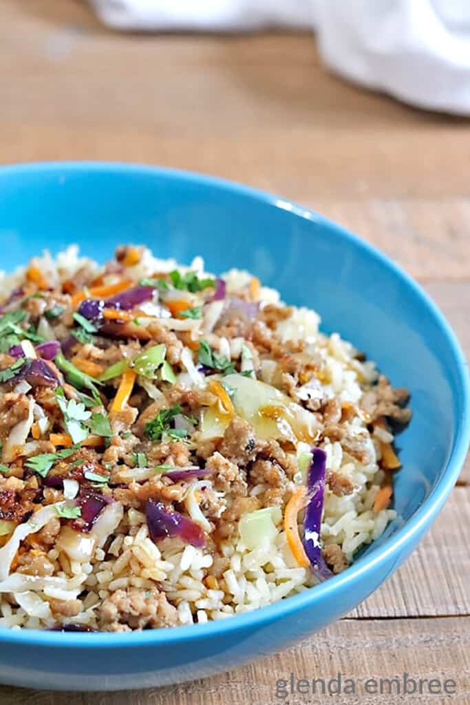 egg roll in a bowl served in blue stoneware dish