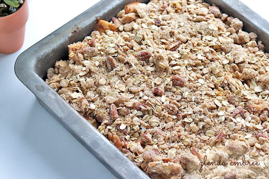streusel topping spread over apples