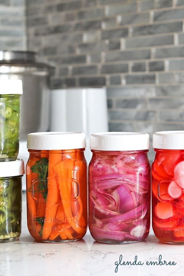 quick pickled jalapenos and quick pickled vegetables in jars