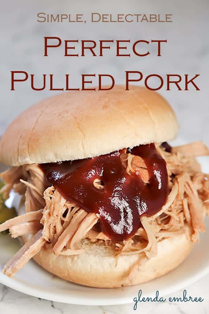 Perfect Pulled Pork Sandwich with barbecue sauce and pickles