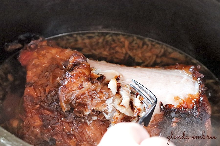 removing fat cap from cooked pork loin roast for perfect pulled pork