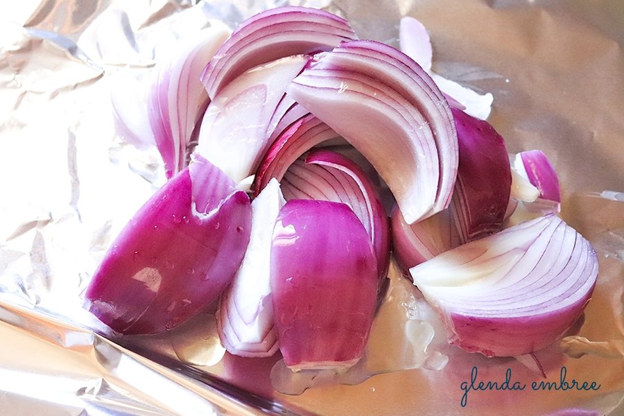 red onion quartered and drizzled with oil