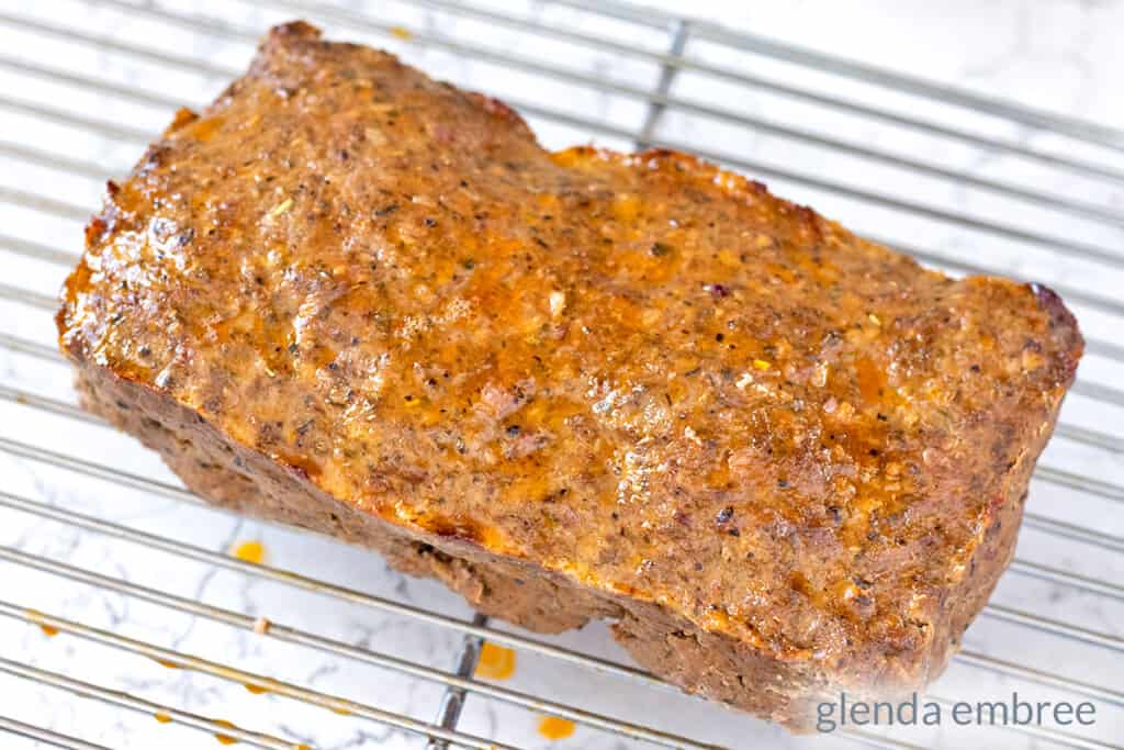 baked homemade gyro meat loaf on a cooling rack