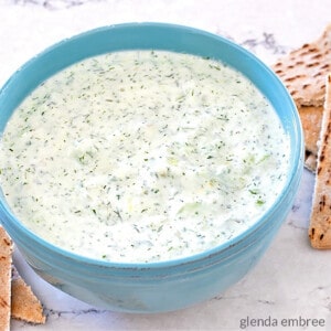 homemade tzatziki in a blue stoneware bowl with pita chips