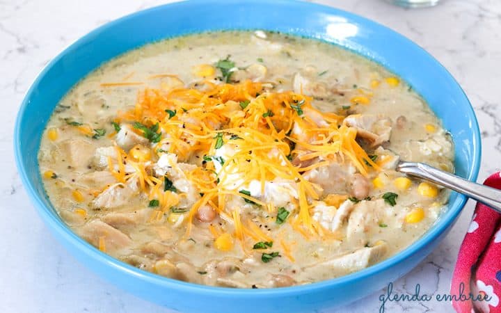 poblano chicken chili with sour cream, shredded cheddar and minced cilantro