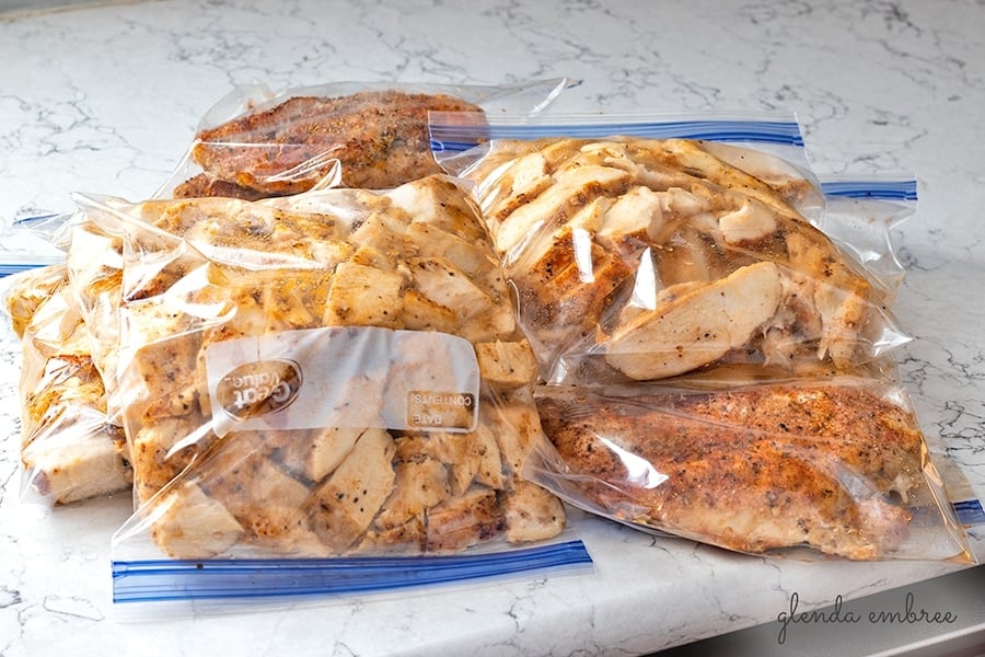 Perfect Baked Chciken Breasts prepped for storage in fridge or freezer. Bags of sliced, chopped and whole chicken breasts in zip-top freezer bags.