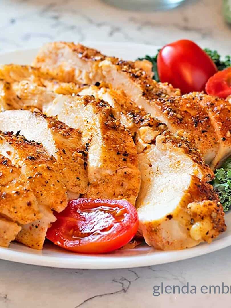 Perfect Baked Chicken Breasts on a white plate.