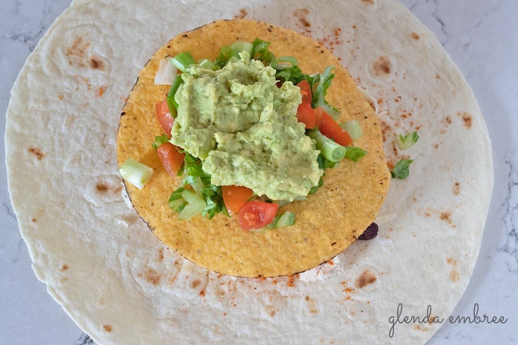 How to Assemble a Crunch Wrap: Add guacamole.