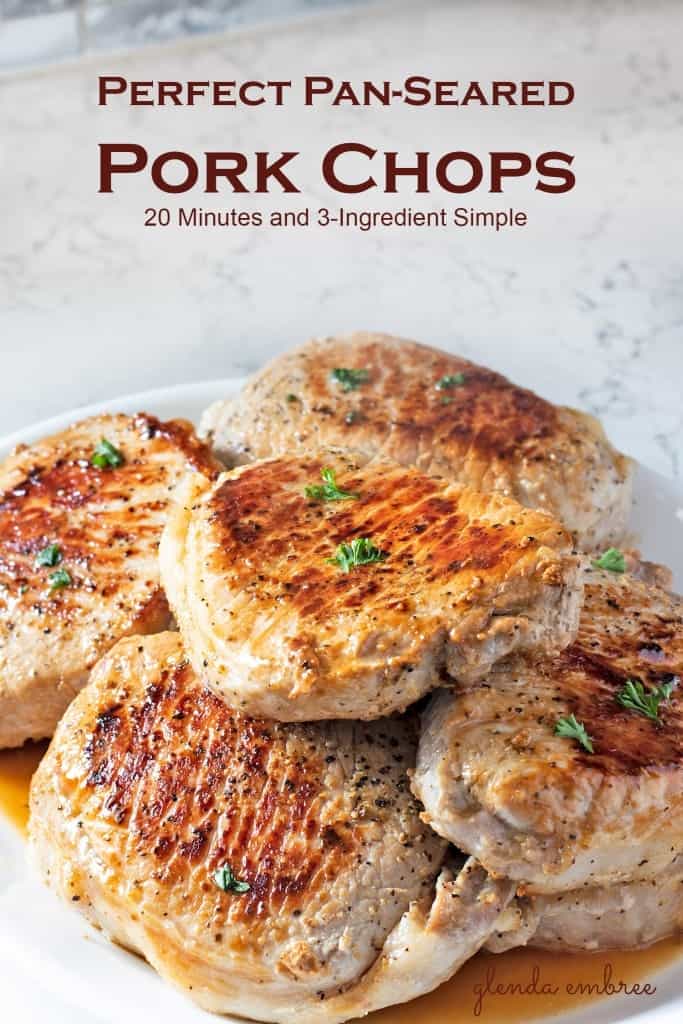 Perfect Pan Seared Pork Chops on a white serving platter