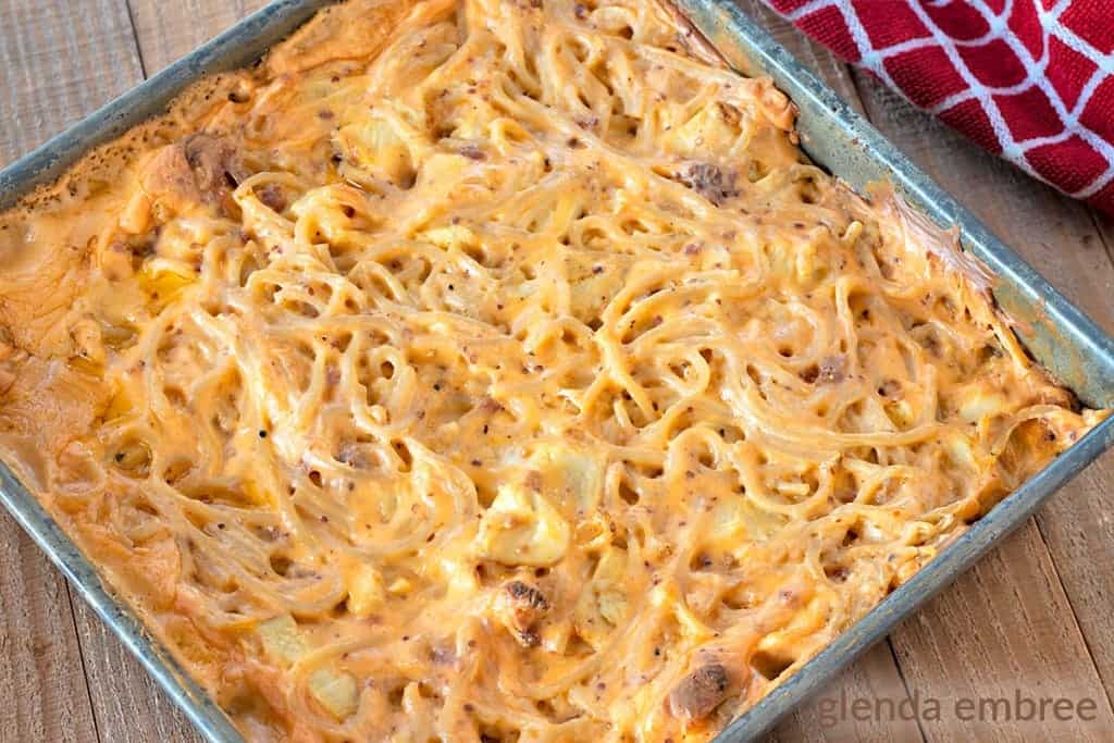 cheesy chicken spaghetti baked in a 9x9 metal pan