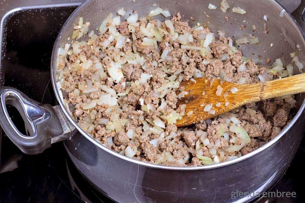 browned ground beef and onions in a soup pot