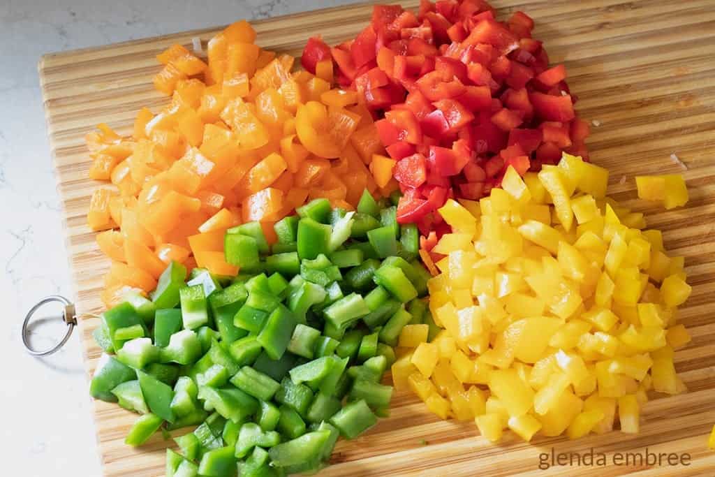 diced bell peppers, orange, red, yellow and green