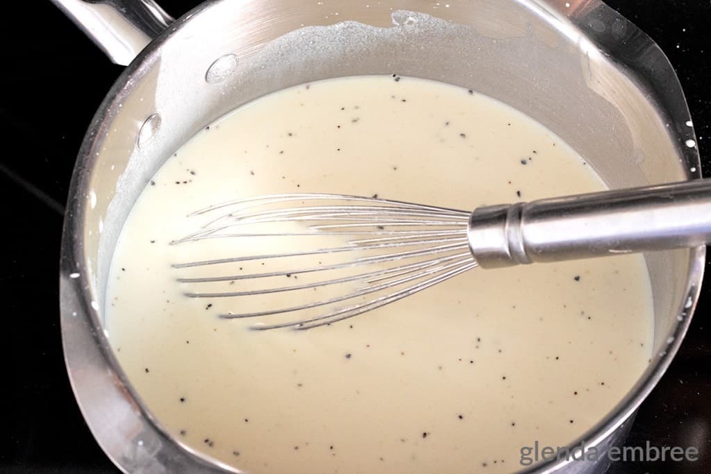 homemade cream of chicken soup mixture added to a saucepan