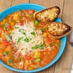 Stuffed Pepper Soup in a blue bowl with toasted crostini