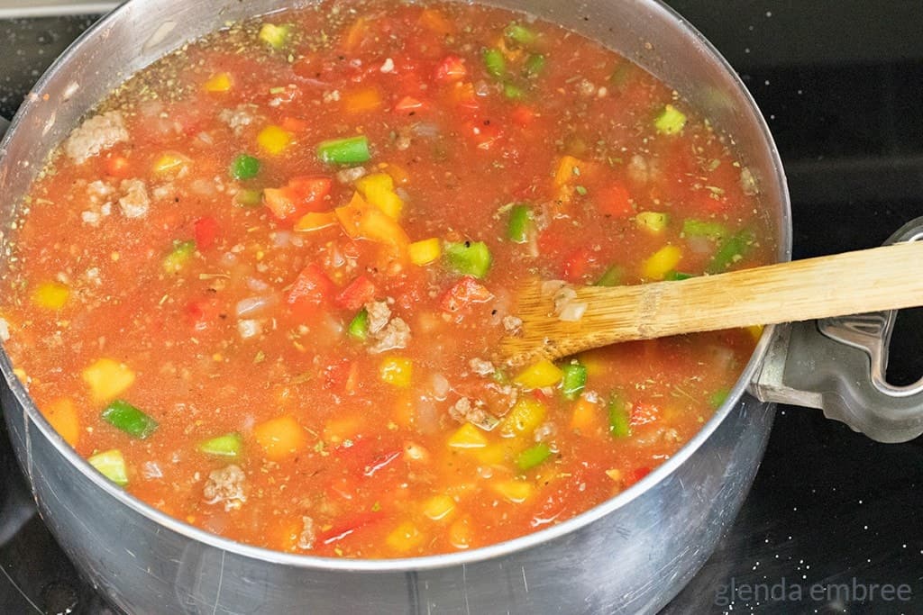 Peppers, tomatoes and broth stirred into Stuffed Pepper Soup