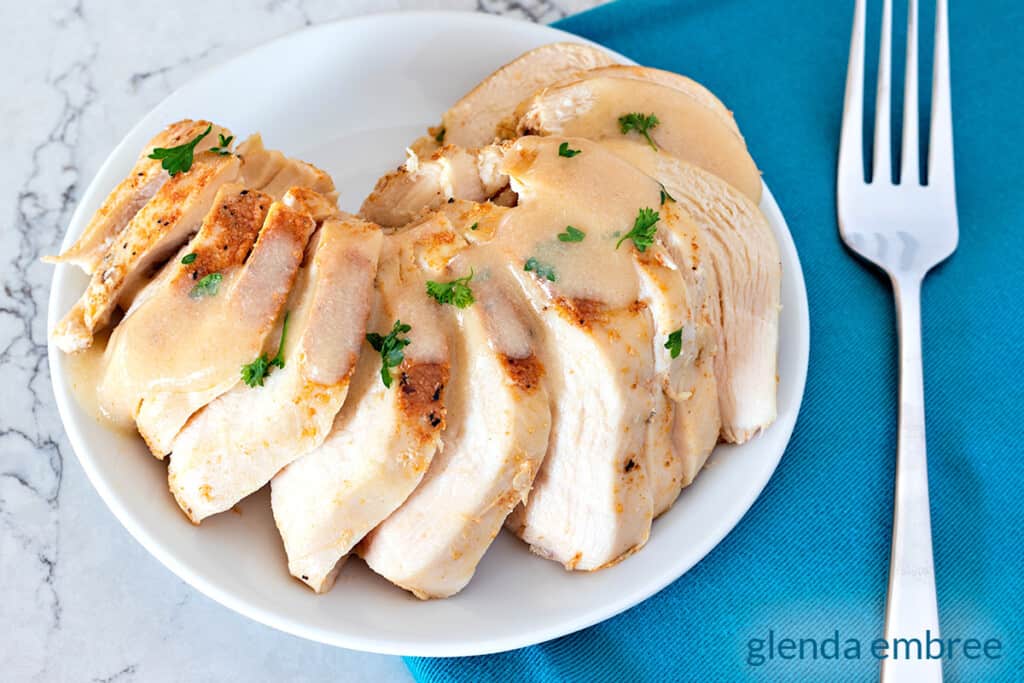 Easy Slow Cooker Chicken Breasts (juicy + flavorful!) - Bowl of