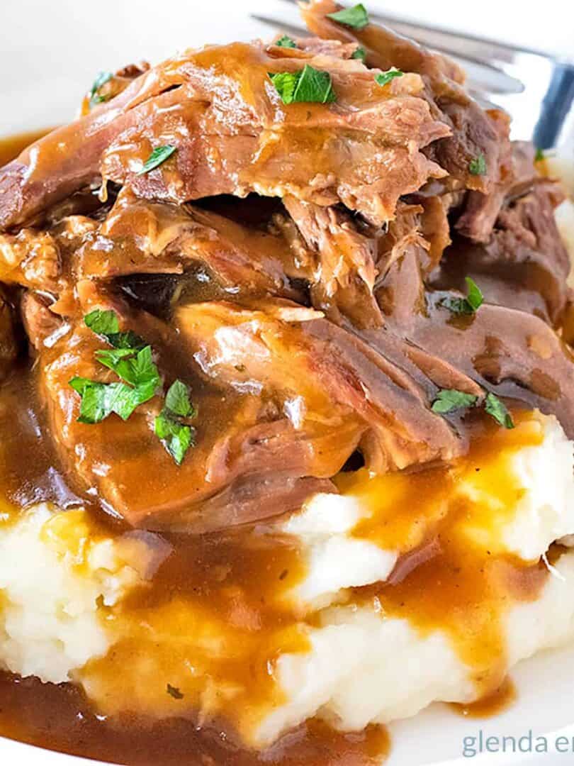 Mississippi Pot Roast served over mashed potatoes with beef gravy