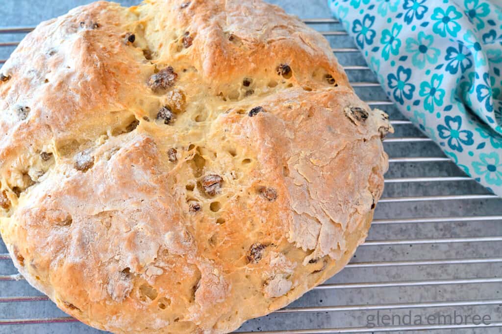 Irish soda bread with raisins on a cooling rack - irish soda bread recipe