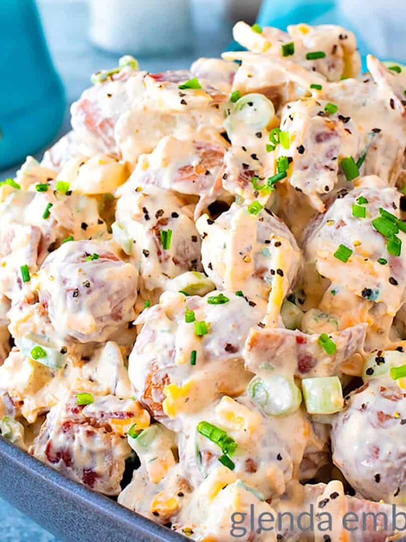 loaded baked potato salad in a gray rectangular pottery bowl