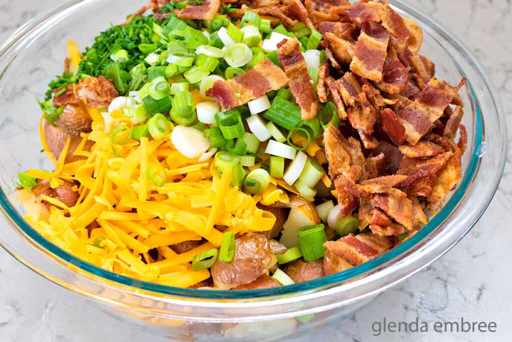Loaded Baked Potato Salad ingredients in a bowl