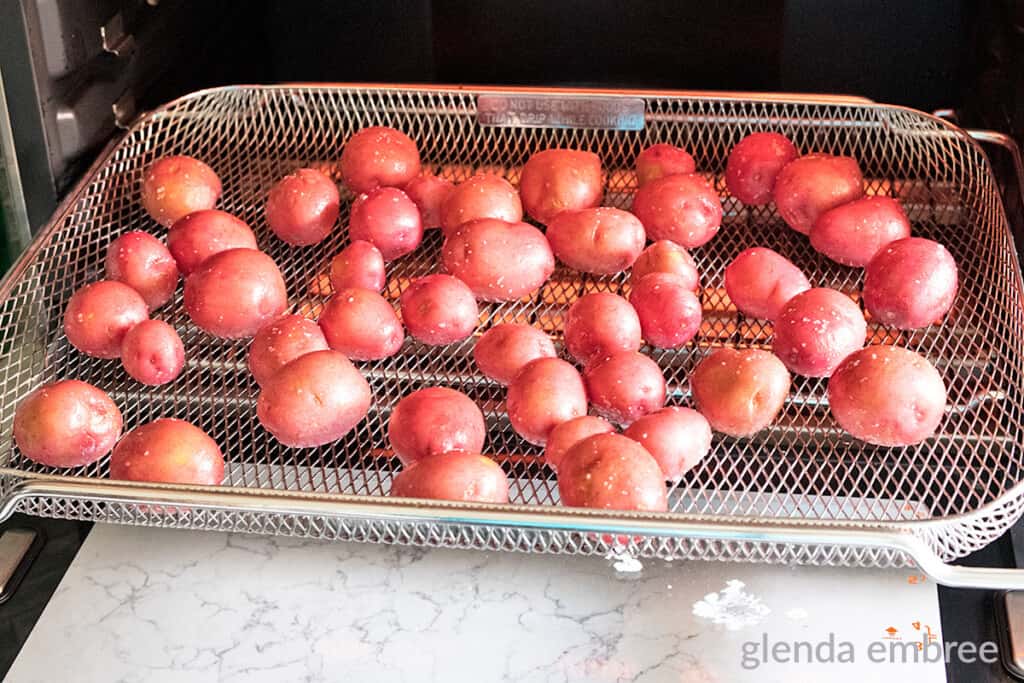 baby red potatoes in the air fryer basket of my Breville Joule Smart Oven