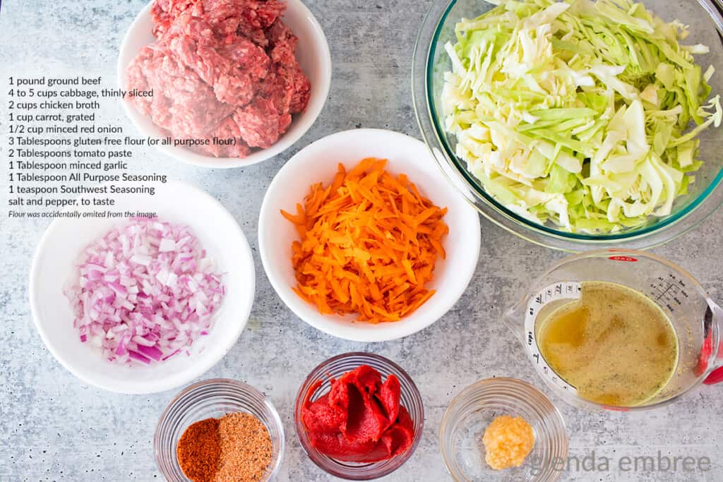 Ingredients for Cabbage and Ground Beef recipe - ground beef, cabbage, grated carrot, minced red onion, chicken broth, minced garlic, tomato paste, all purpose seasoning and Southwest seasoning