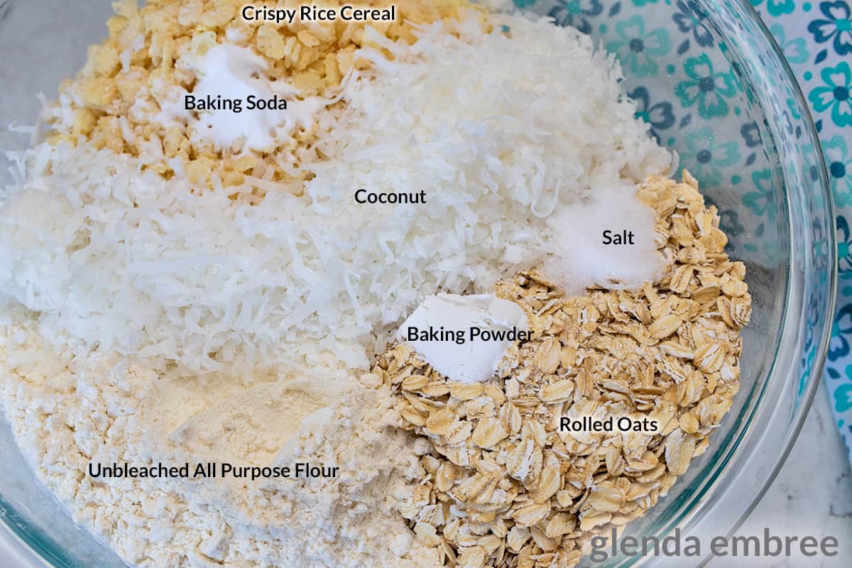 dry ingredients for Ranger Cookies, flour, rolled oats, crisp rice cereal, coconut, baking soda, baking powder and salt