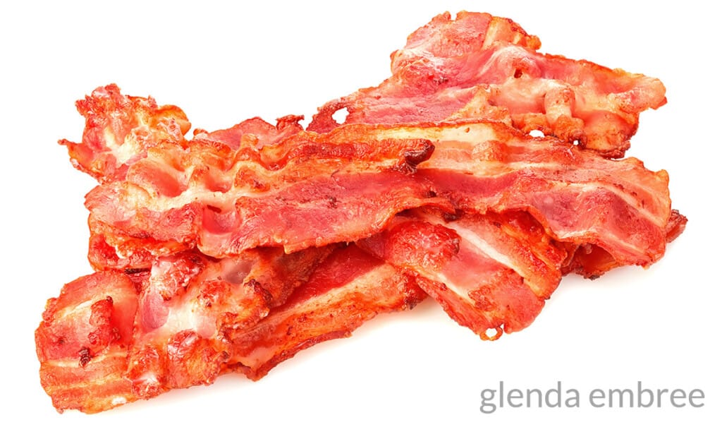 fried bacon on a white background
