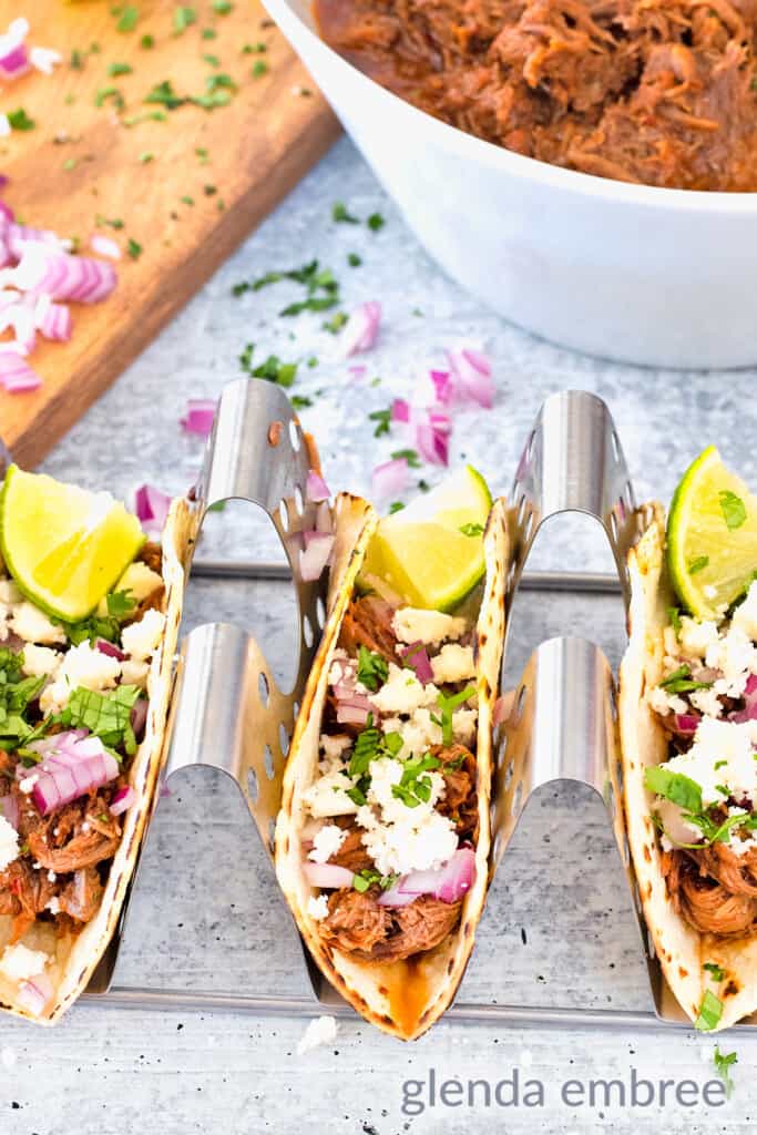 lime and cilantro added to Mexican Street taco build - shredded beef tacos