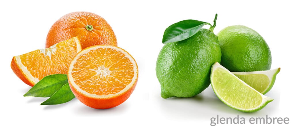 orange and limes, some whole and some cut