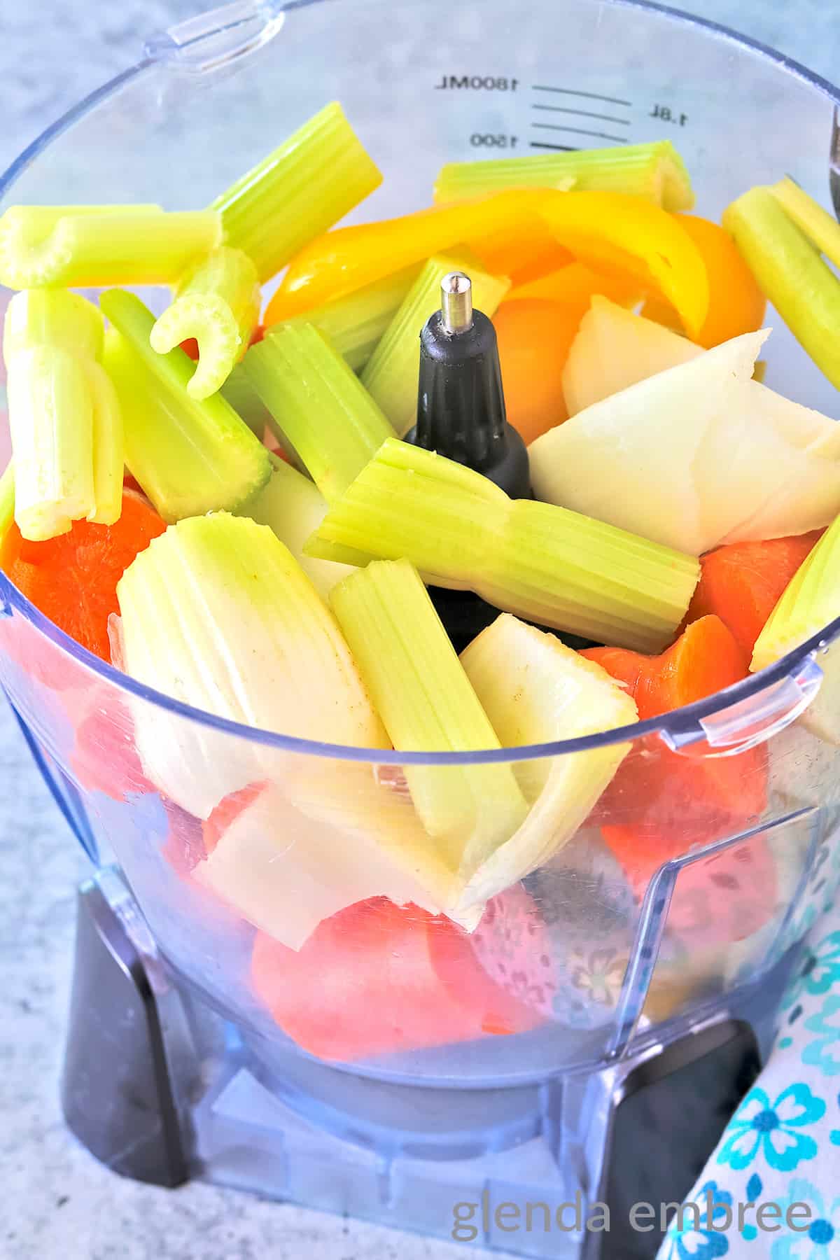 celery, carrots, onions and bell pepper in food processor