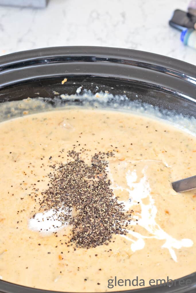 adding black pepper to cream soup in a crock pot