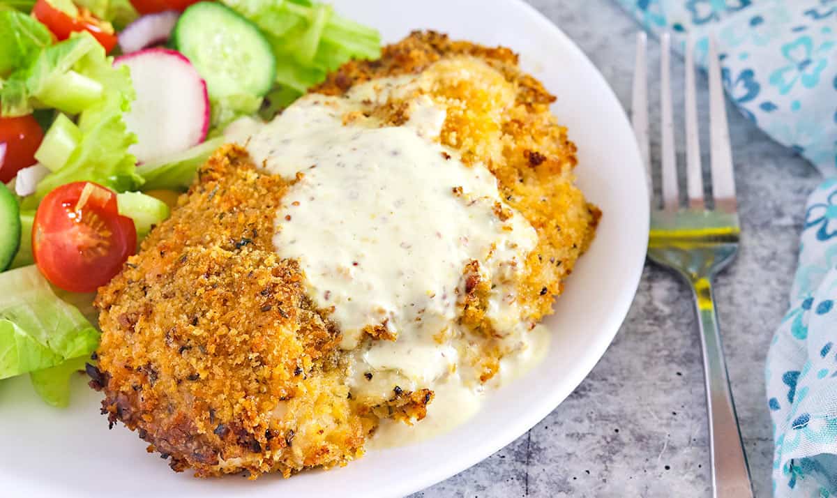 Air Fryer Chicken Cordon Bleu on a White Plate with House Salad