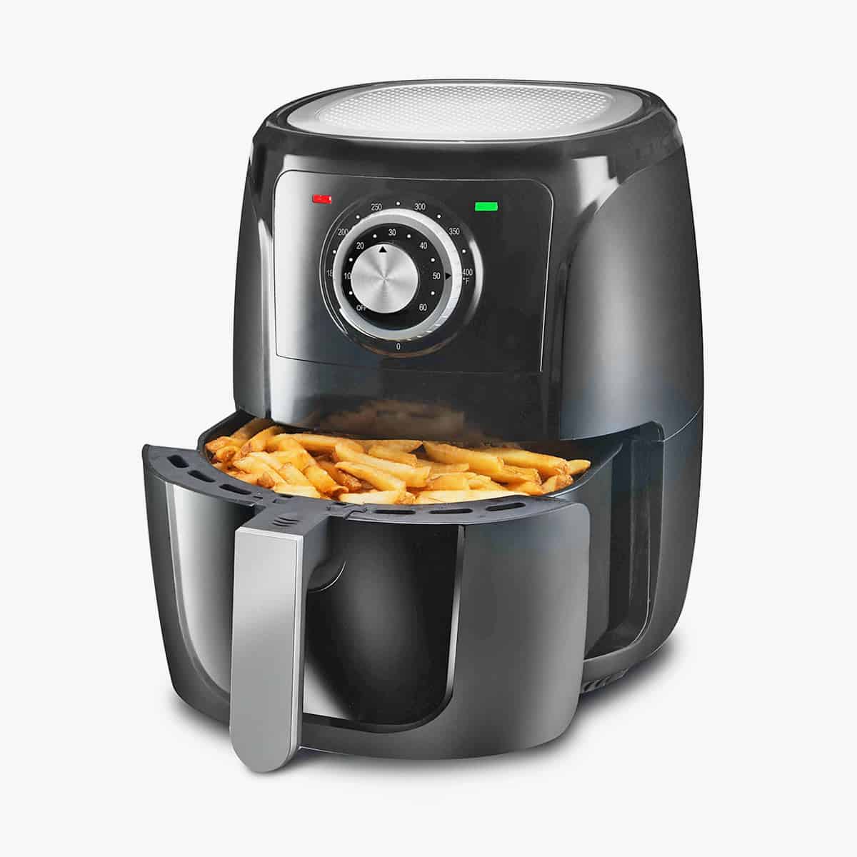 Small portable air fryer with french fries in the basket